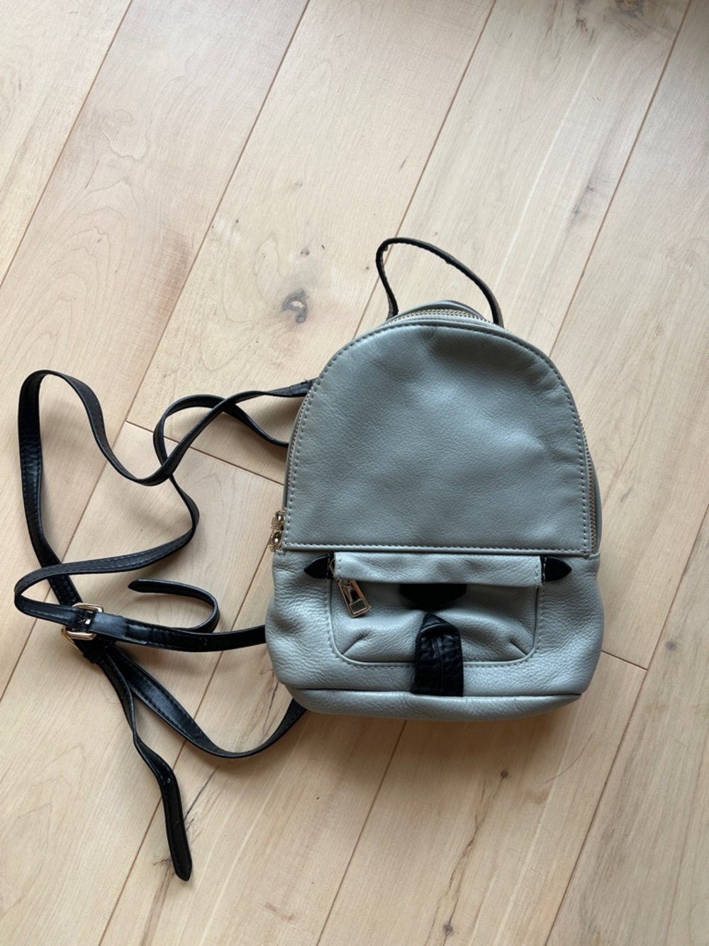 Compact Gray Mini Backpack with Black Trim